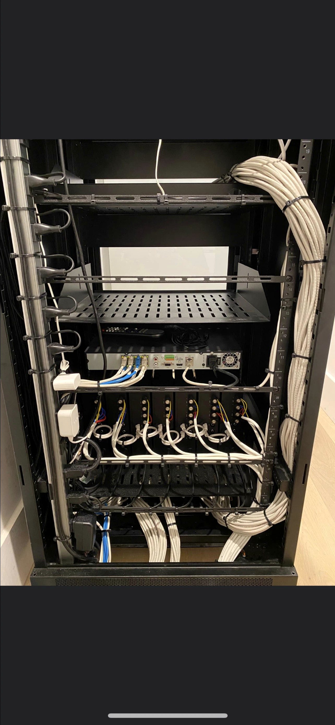 Floor-standing AV rack with cabling